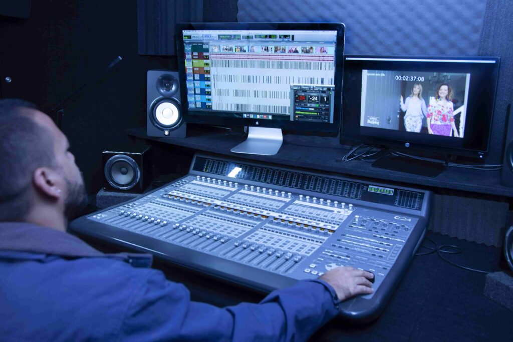 international dubbing service - man mixing booth (0)